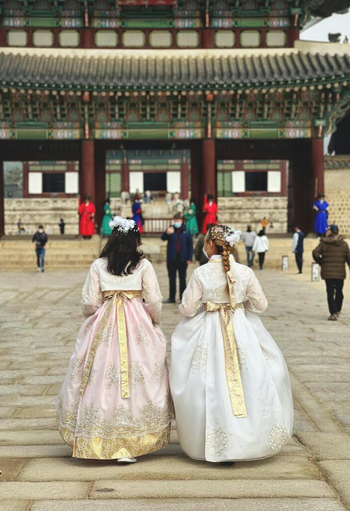 Two girls wearing hanbok as entering Gyeongbokgung, Seoul