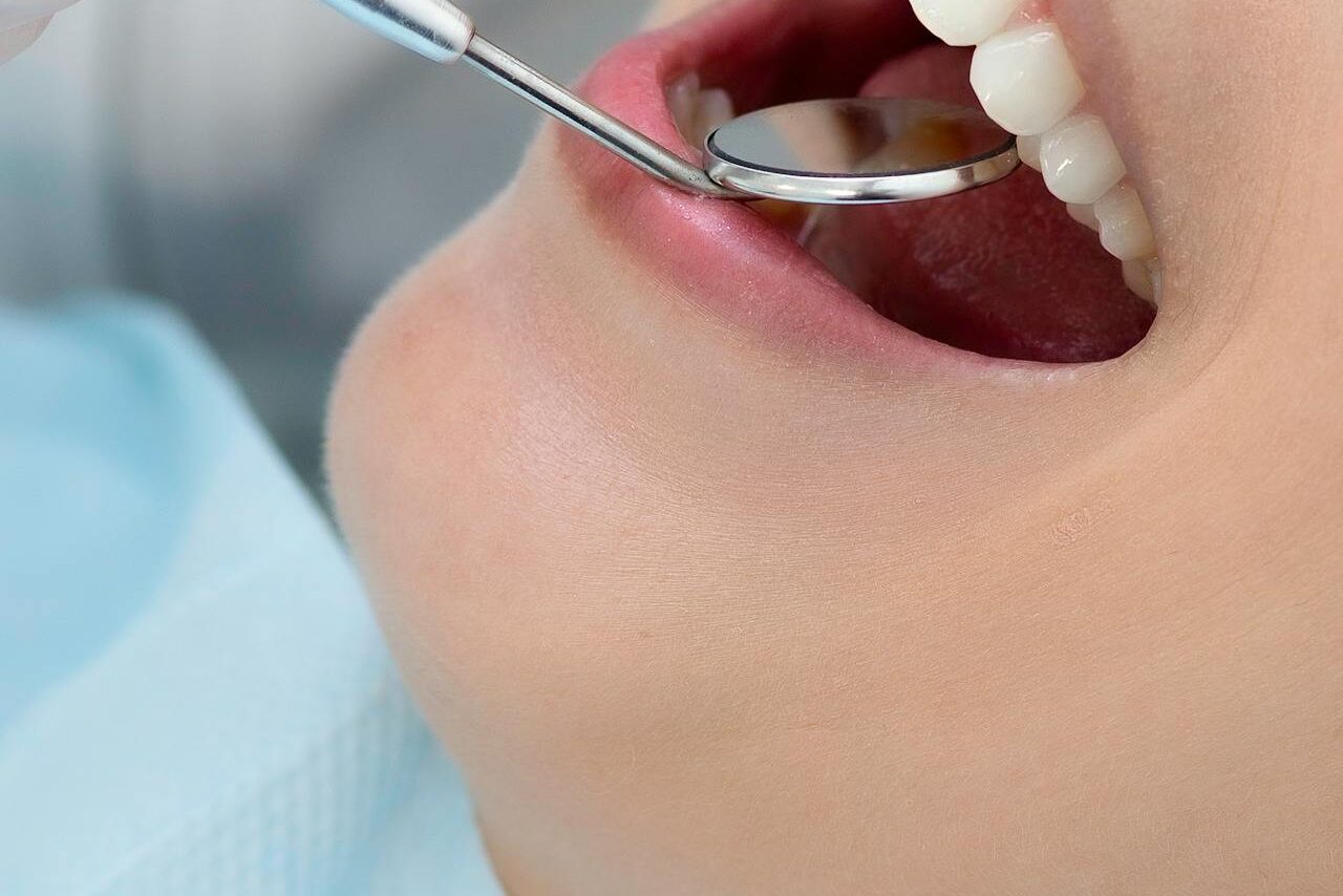 A woman getting general health checkup with dentist