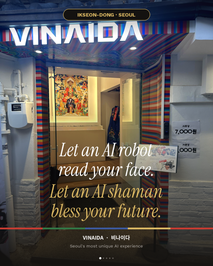 Entrance of VINAIDA Seoul — a small shop with an illuminated white VINAIDA sign, dancheong (Korean temple color pattern) doorframe, and a shamanic painting visible inside. Text overlay: "Let an AI robot read your face. Let an AI shaman bless your future."